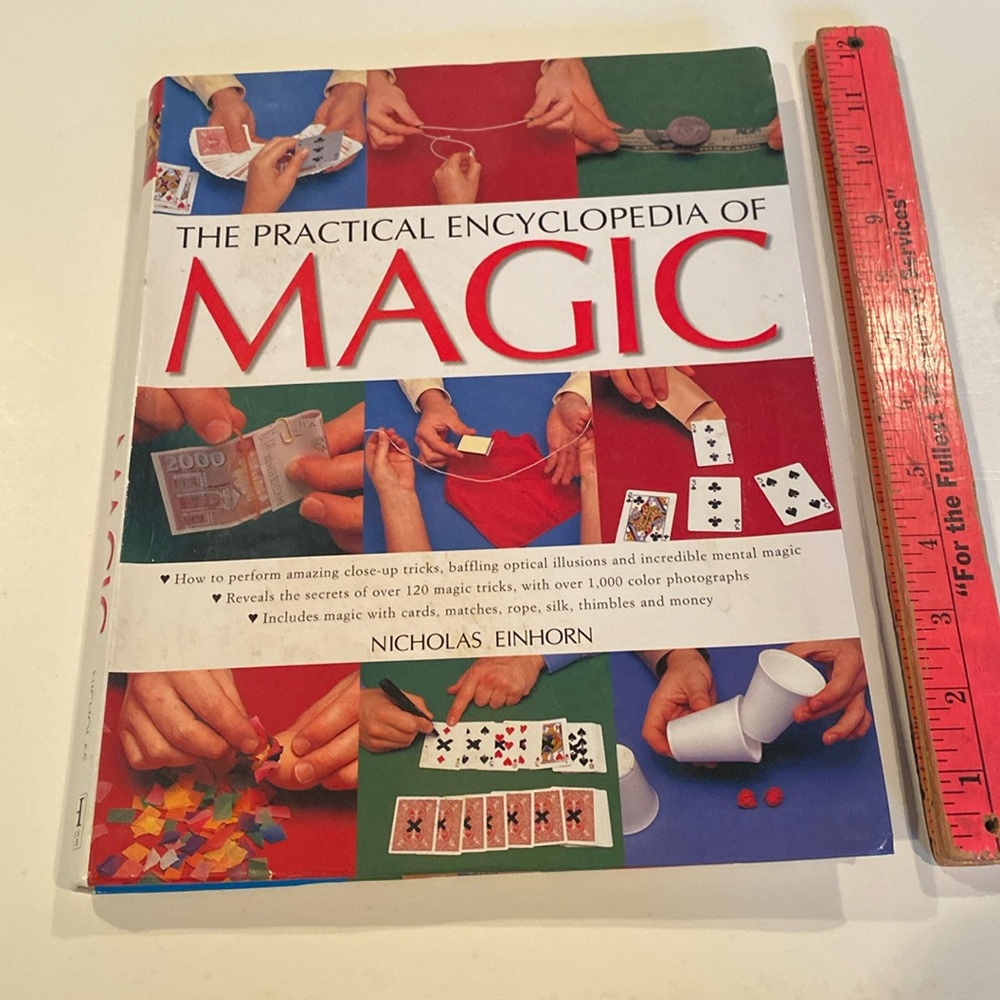 “The Practical Encyclopedia of Magic,” oversized stiff paperback